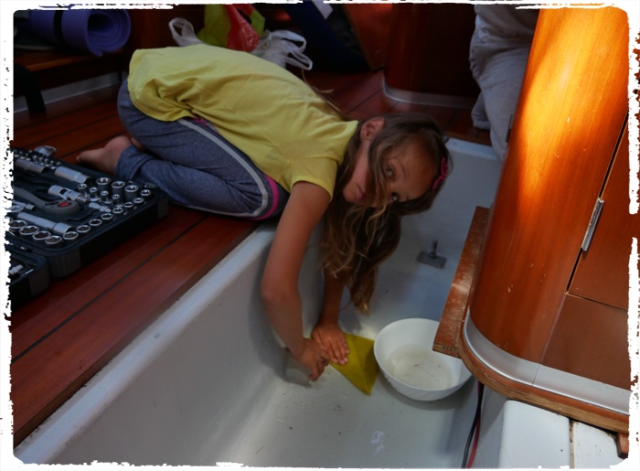 Hard work on the boat to clean fresh water from leaking pipe